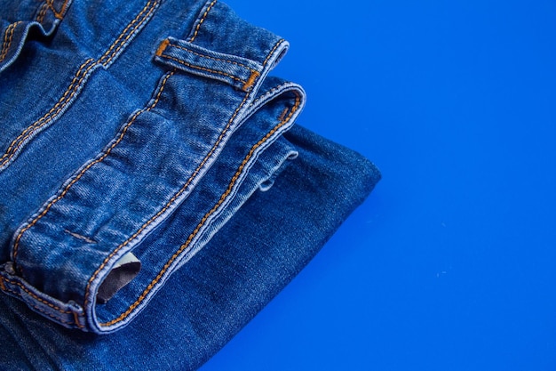 A pair of blue jeans on a blue background