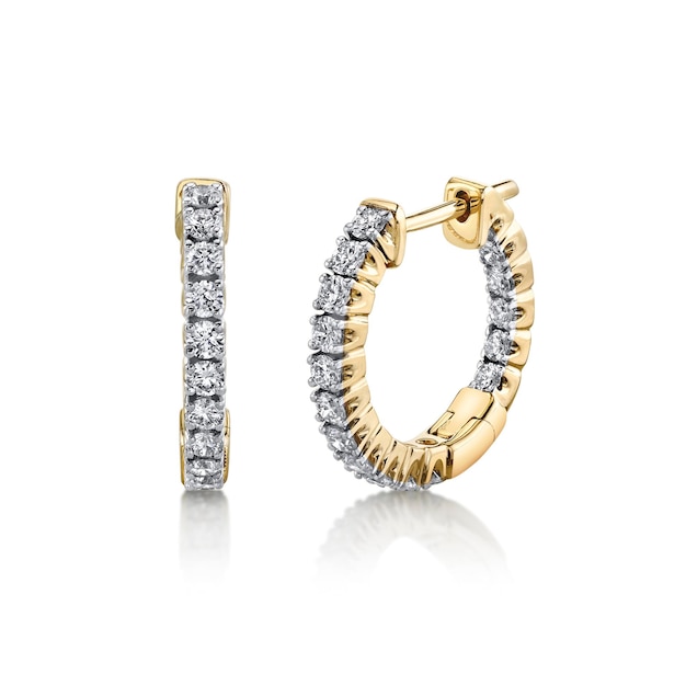 A pair of diamond earrings with diamonds on the side.