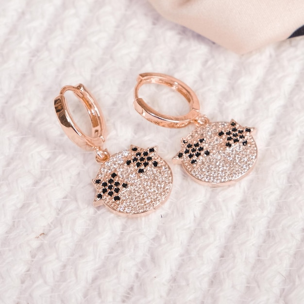 A pair of earrings with diamonds on the side