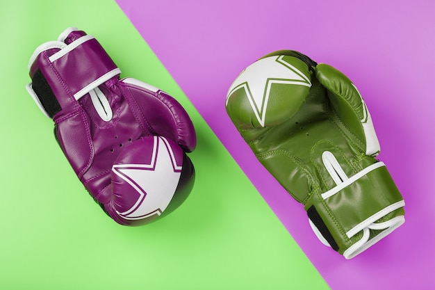 A pair of green and pink boxing gloves