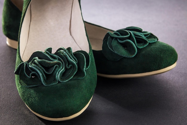 A pair of green suede flats