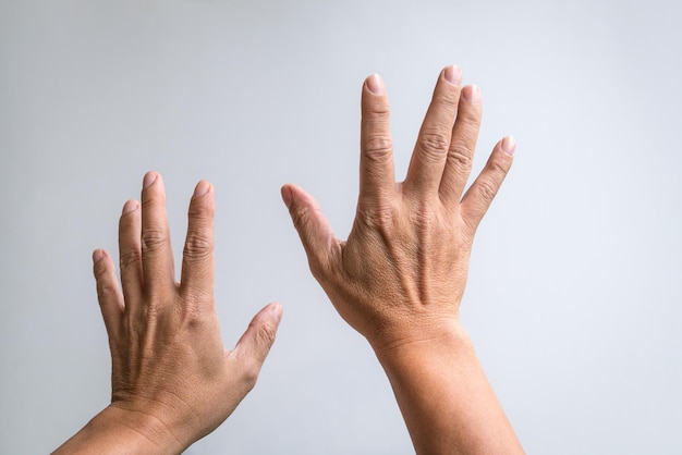 Pair of hands reaching up