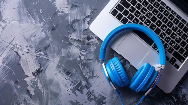 a pair of headphones with a laptop on the table