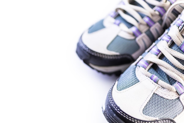 Pair of new womens hiking shoes on a white background.