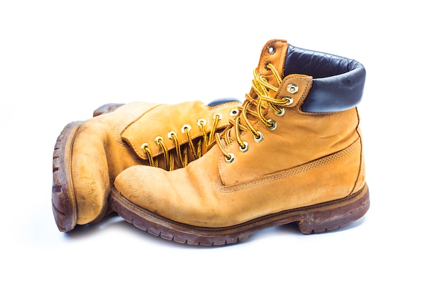 Pair of old yellow working boots，Nostalgic