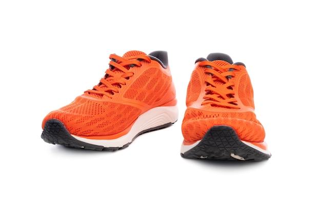 Pair of orange sport sneakers isolated on white