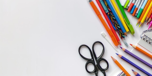 a pair of scissors next to a pencil and a pencil