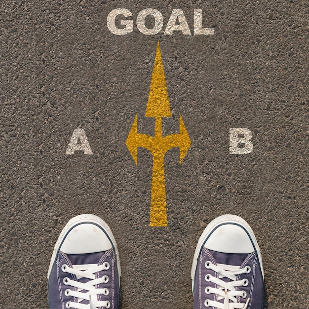 Pair of shoes standing on a road with business concept