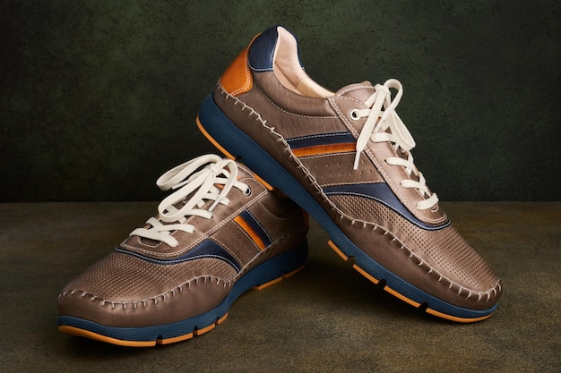 Pair of stylish leather sports shoes for men fashion concept