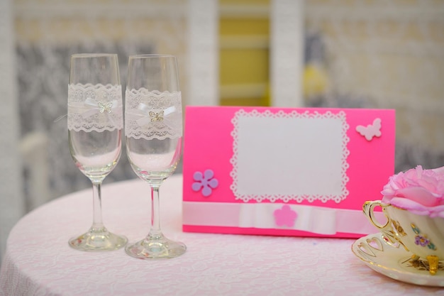 Pair of wedding wineglasses on the table