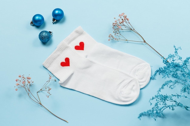 Pair of women socks on blue background