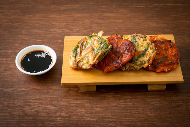 Pajeon or Korean pancake and Korean Kimchi pancake or Kimchijeon on white background