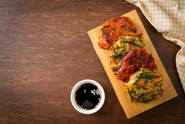 Pajeon or Korean pancake and Korean Kimchi pancake or Kimchijeon on white background