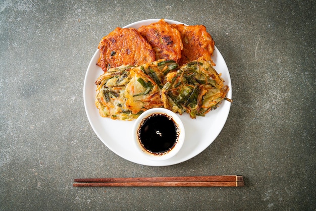 Pajeon or Korean pancake and Korean Kimchi pancake or Kimchijeon on white background