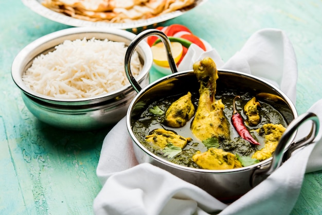 Palak or spinach Chicken or Murg Saagwala served in a bowl with Naan and rice