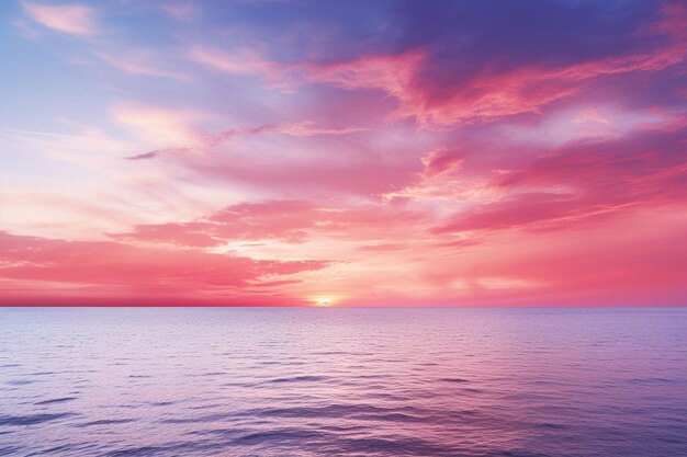 A pale blue sky with a pink and yellow cloud background