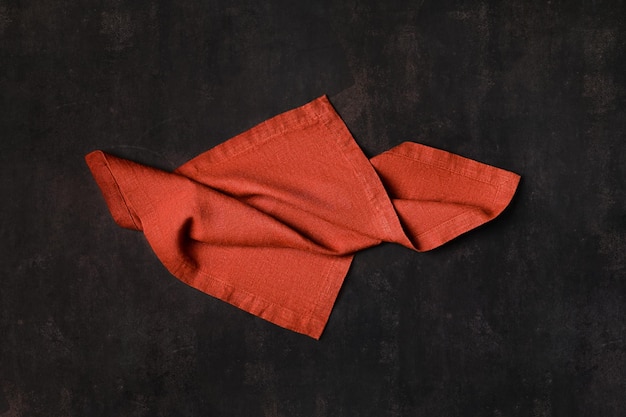 Pale red napkin on dark background