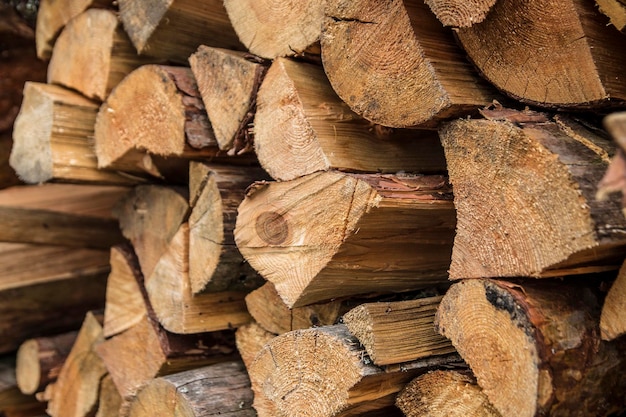 The palette of fresh lumber. Firewood for heating in agriculture.