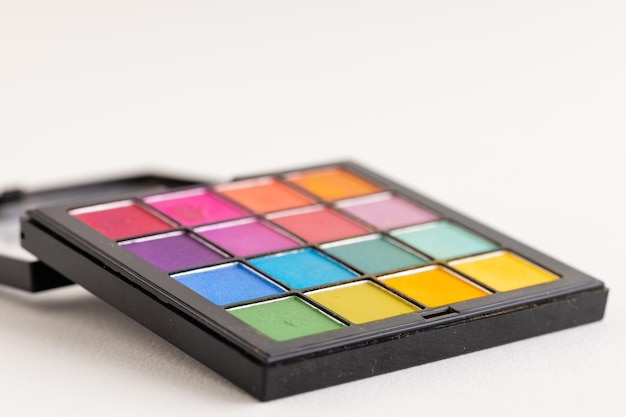 Palette of multicolored eyeshadows closeup