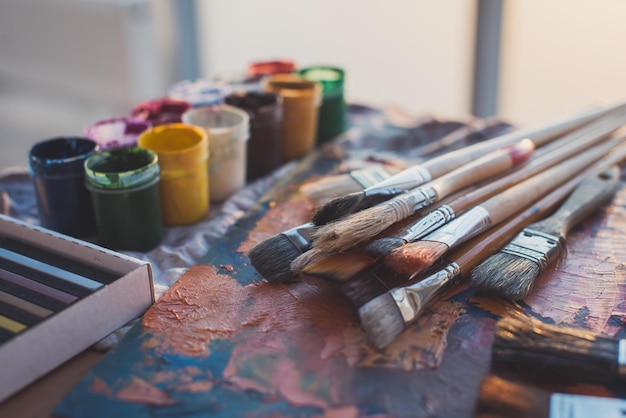 Palette with oil paints and gouache set Clean painter workplace ready for drawing