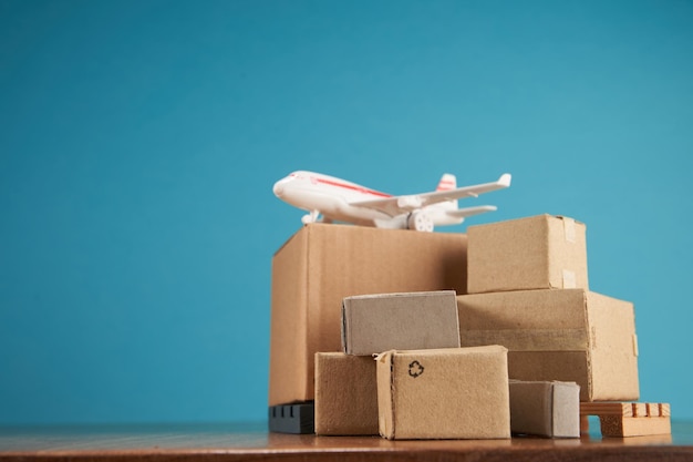 Pallet of cardboard boxes and toy airplane