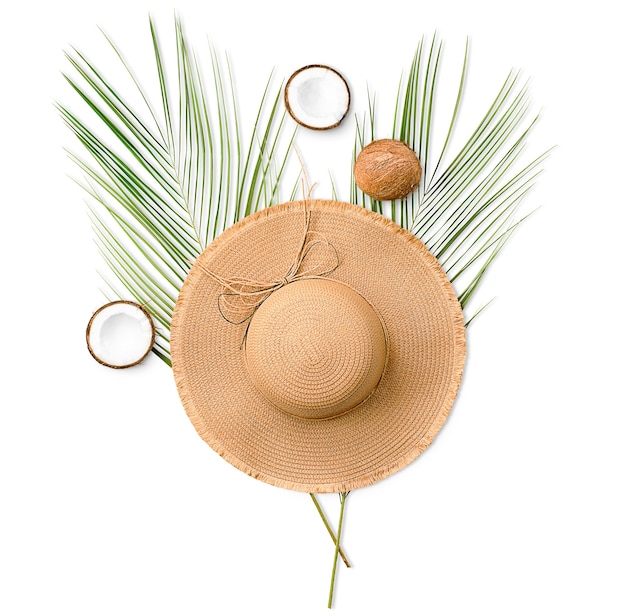 Palm leaf, coconut and sun hat isolated