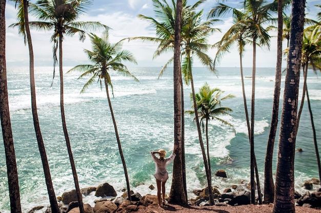 Palm trees sea and girl