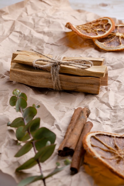 Palo Santo wood sticks on craft paper with aromatherapy accessories Incense for meditation