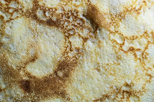 Pancake surface texture and pattern Closeup of thin hot pancakes in a plate Traditional rustic food Graphic resource