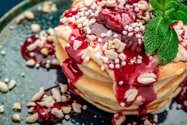 Pancake tower with yogurt nuts and cherry jam