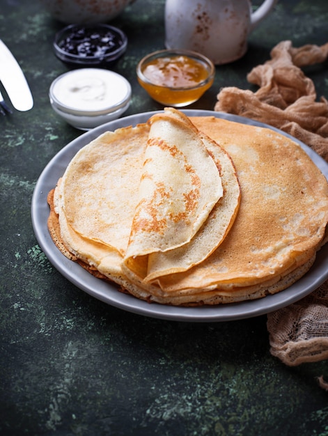 Pancakes crepes with different jam and cream