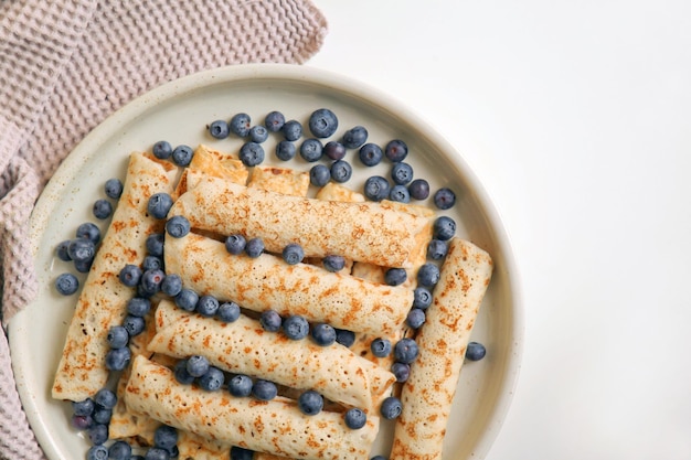 Pancakes on plate with blackberry delicious pancakes with blueberries on a white plate flat lay