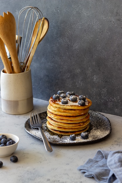 Pancakes with blueberries and honey. Breakfast. Vegetarian food. Recipe.