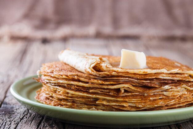 Pancakes with butter and honey.Carnival.selective focus.