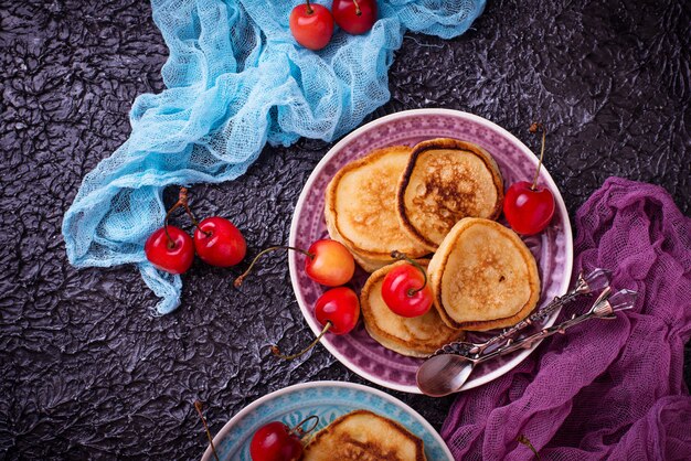 Pancakes with cherry. Selective focus