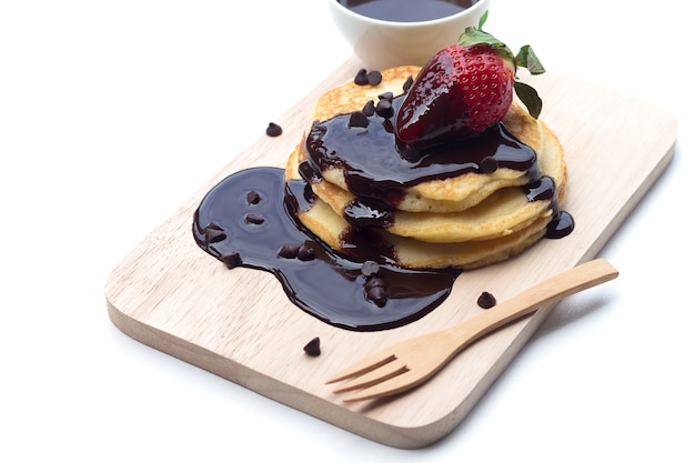 Pancakes with chocolate syrup and strawberry