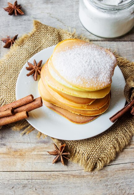 Pancakes with honey and butter. Selective focus.