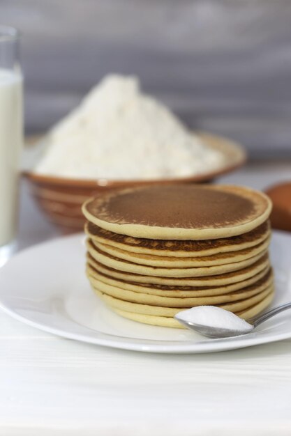 Pancakes with ingredients flour eggs milk soda