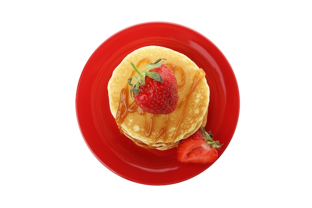 Pancakes with strawberry and caramel isolated on white background