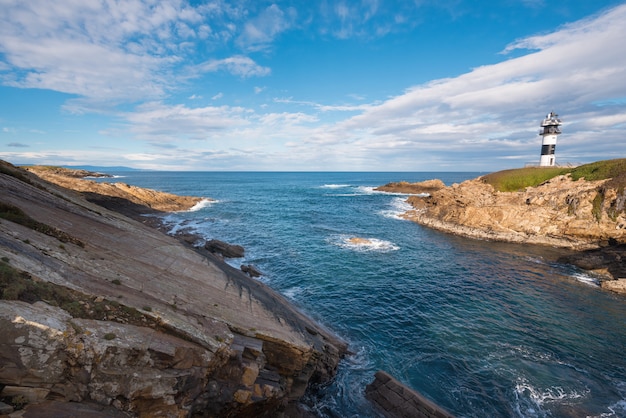 Pancha island lighthouse in Ribadeo coastline, Galicia, Spain.