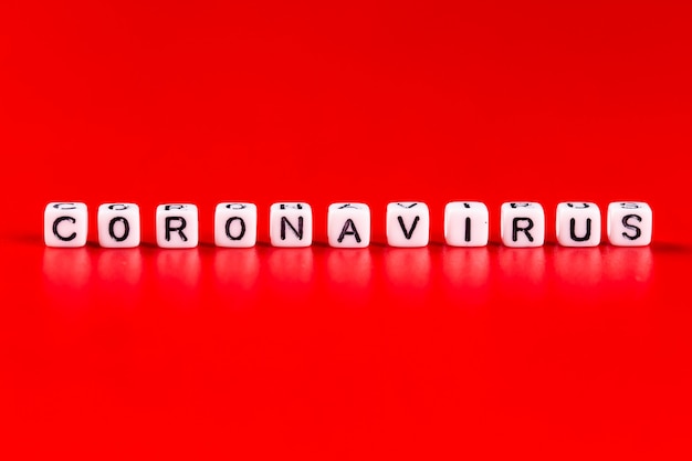 Pandemic and virus concept - Coronavirus word made of white blocks. Coronavirus text on red background.