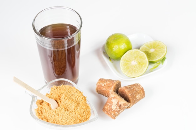 Panela cubes and lemon or sugar cane candy on a white background typical food from Colombia