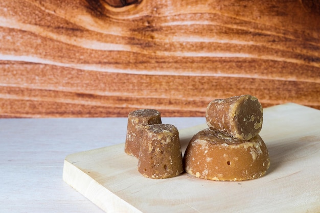 Panela cubes or sweet sugar cane on a chopping board typical food of Colombia