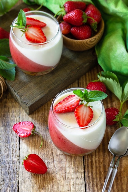 Panna cotta with strawberry jelly and fresh strawberries summer italian dessert home cooking