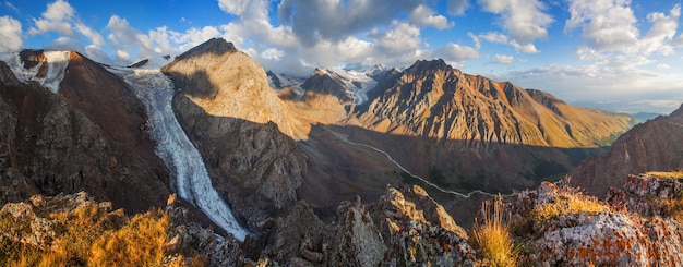 Panorama of Altai Mountains in morning light, rocky peaks and glaciers