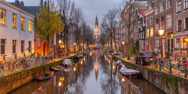 Panorama of amsterdam canal groenburgwal with zuiderkerk southern church holland netherlands