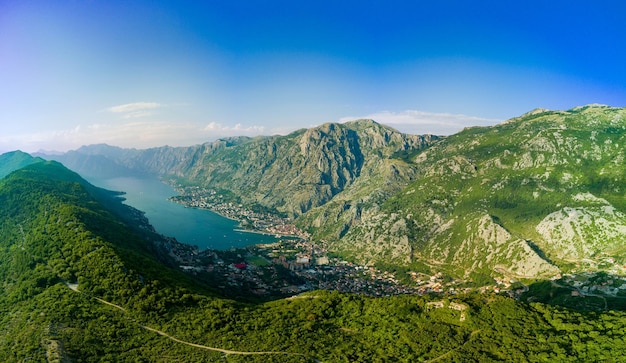 Panorama of the Bay of Kotor with beaches and hotels and the Adriatic Sea against the backdrop of sunny sky