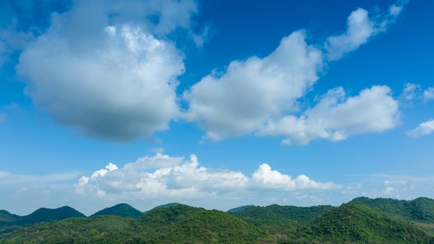 Panorama of beautiful countryside with sky cloud sunny sky afternoon tree on green field mountain