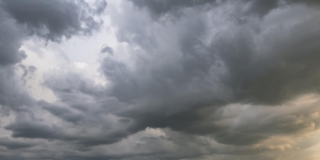 Panorama of black sky background with storm clouds thunder front