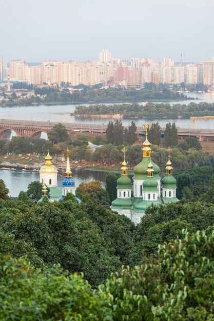 Panorama of the city Kiev. Ukraine. Monastery Vydubitsky. The Dnieper River and new buildings in Kiev